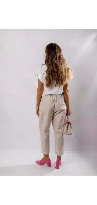 Ці брюки кремового кольору від Imperial – ідеальний вибір для створення стильного та елегантного образу., одяг від Jador