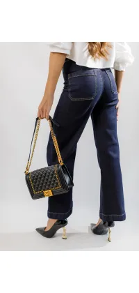 Джинси кльош з золотими ґудзиками від французького виробника, одяг від Jador