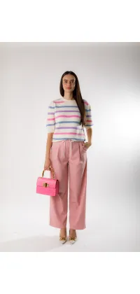 Рожевий акцент: бавовняні штани від французького бренду, що підкорюють серце, одяг від Jador