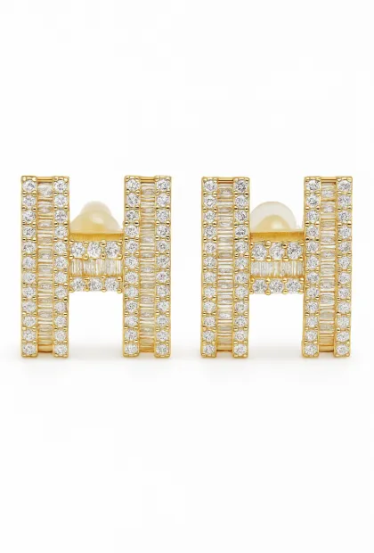 Золотисті сережки з інкрустацією кристалів