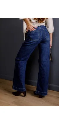 Темно-сині джинси-кльош з високою посадкою. Колір: Джинс