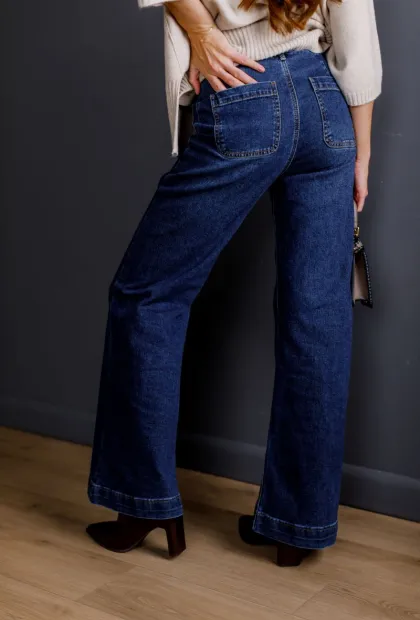 Темно-сині джинси-кльош з високою посадкою